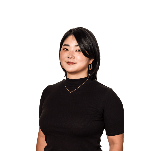 Portrait of a woman with black hair and earrings, wearing a black shirt, representing community engagement for Murmur Creative at the Love Bomb 2015 event supporting Street Roots.